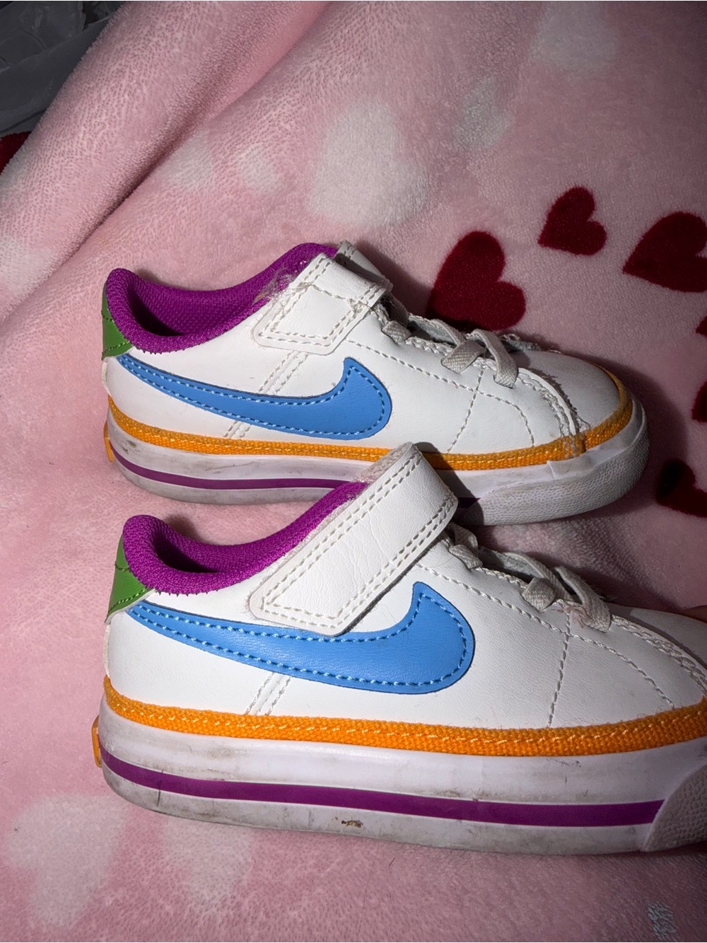Nike Kids White Sneakers with Blue Swoosh, Purple Lining and Orange Trim